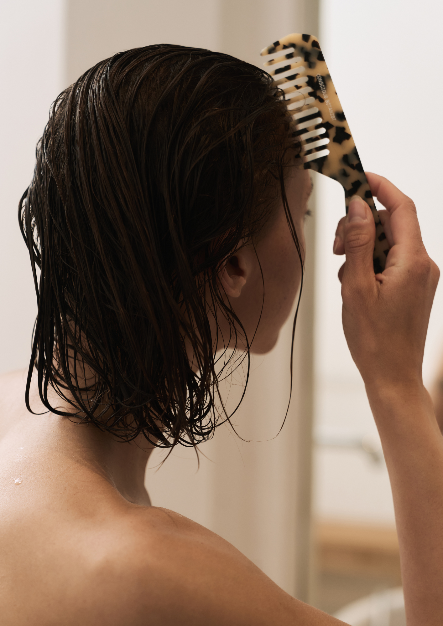 woman using a luxury acetate comb